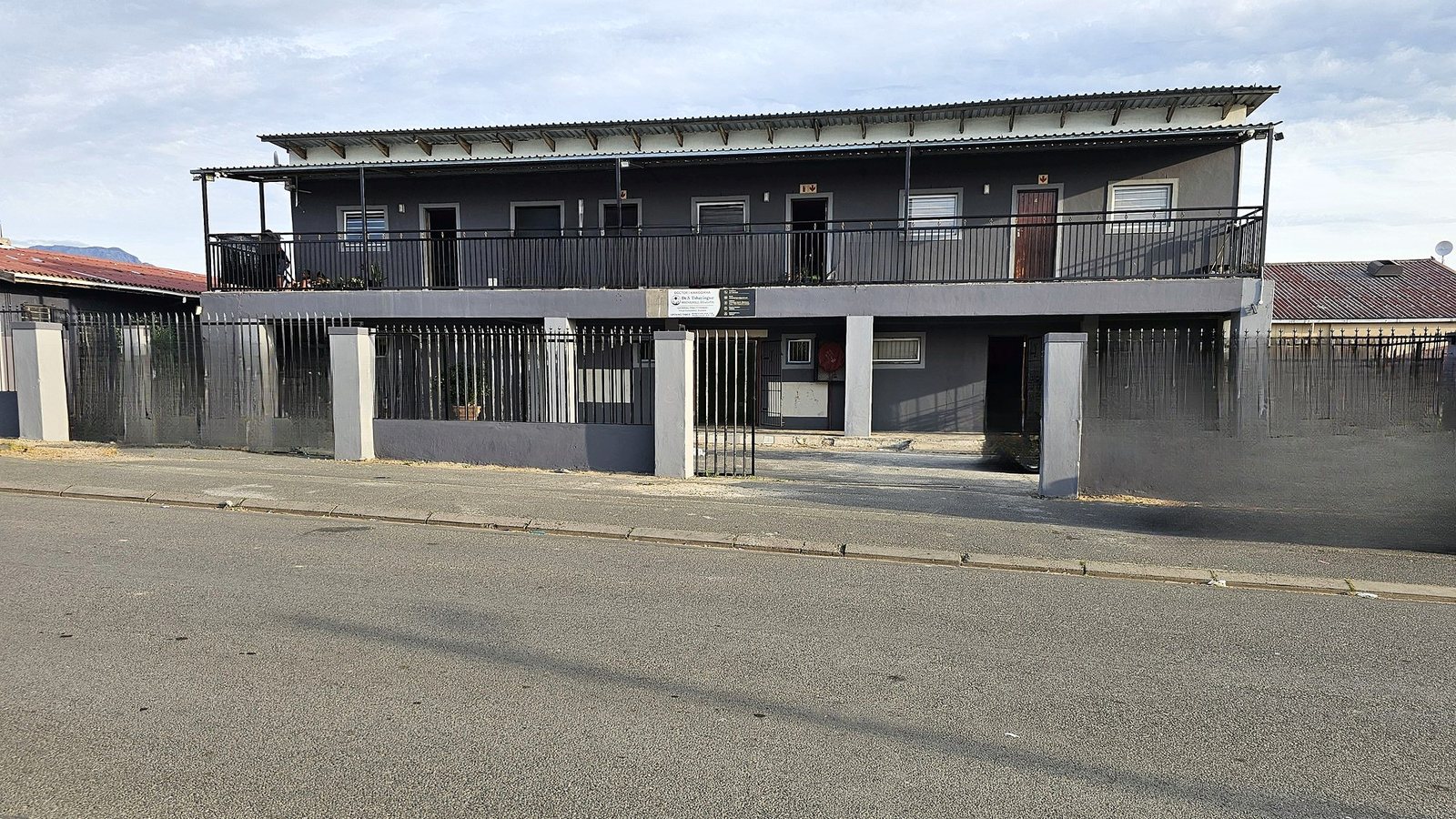 The practice building on 3 Matakata Street: a grey two-storey building with the practice sign above the ground-floor entrance